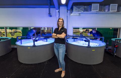 Dr. Bahr next to coral tanks